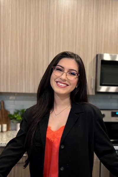 Vanessa Ribeiro, RDN, standing in a kitchen.